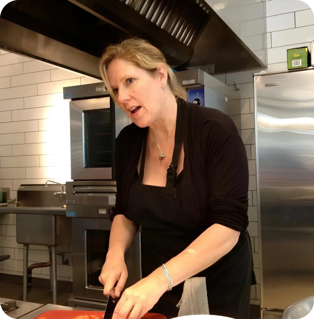 Woman cooking in a professional kitchen